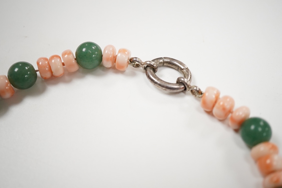 A 20th century adventurine quartz and coral bead set necklace, with a 925 clasp, 80cm, together with a similar carved coral line drop pendant, with a 750 white metal clasp.